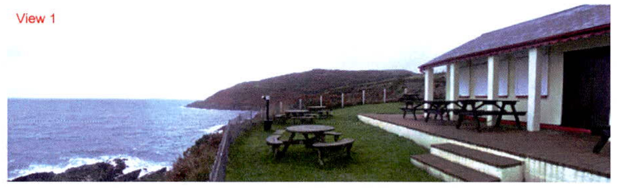 A photograph labeled 'View 1' showing a coastal building with a veranda and picnic tables overlooking the sea and a headland.