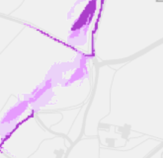 The image displays a schematic map or site plan featuring faint grey road lines and prominent purple highlighted zones, likely indicating the site boundary or proposed development area.