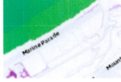 A cropped section of a site location map displaying 'Marine Parade' with green land areas and property boundaries.