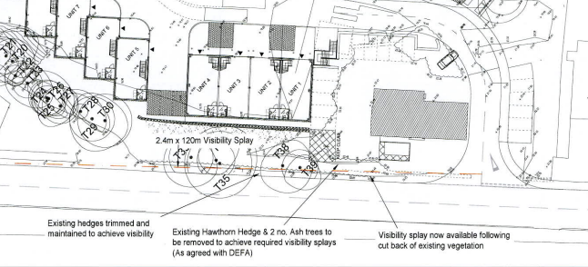 A black and white site plan showing the layout of five commercial units, surrounding trees, and visibility splay requirements at the road frontage.