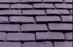 Close-up photograph showing the texture and pattern of slate roof tiles.