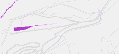 A schematic site plan showing a proposed development area highlighted in purple along a road network.