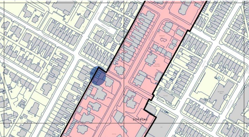 A site location map showing a street of terraced houses with a specific property highlighted by a blue circle and a larger area shaded pink.