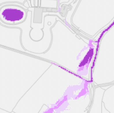 A digital site plan showing land boundaries and purple highlighted areas indicating the proposed development footprint.