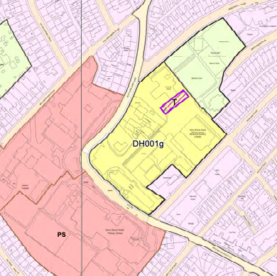 A colored zoning map displaying land use designations and property boundaries, highlighting the application site in purple.