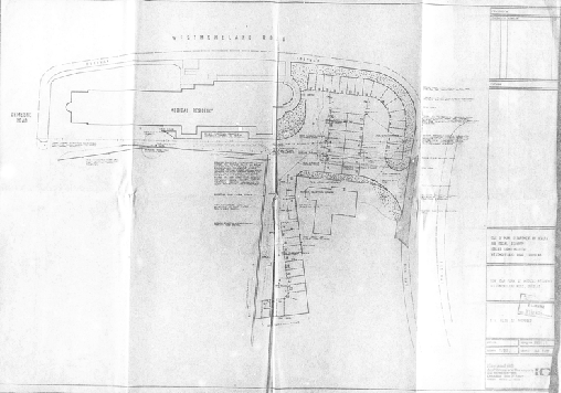 A black and white architectural site plan showing the layout of a property on Nimhillard Road with building footprints and road access.