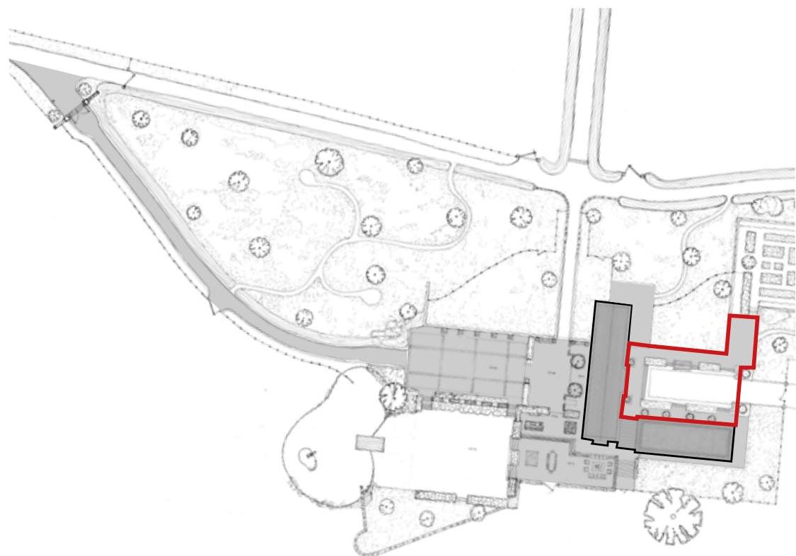 This is a site plan showing the layout of a property with building footprints and landscaping features. The plan highlights a specific building footprint in red outline.