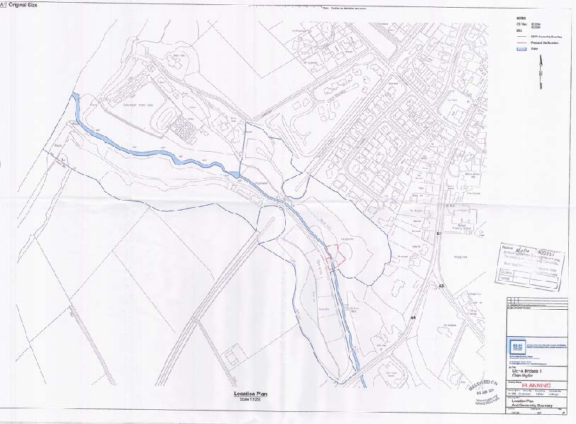 A black and white site location plan showing field boundaries, roads, and a winding watercourse with a legend and title block.