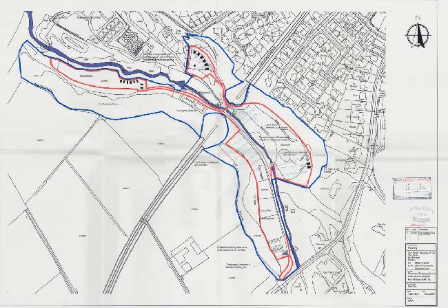 A site plan showing the proposed layout for a camping and cabin development, marked with red and blue boundary lines and existing structures.