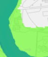 A cropped section of a site location map showing distinct green land areas and a white area with faint road or building outlines.