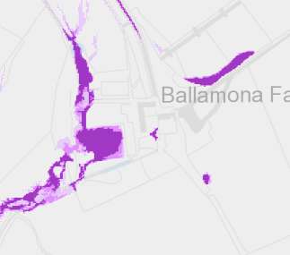 A digital map showing a location labeled 'Ballamona Fa...' with irregular purple zones overlaid on a road network, likely indicating land designations or environmental constraints.