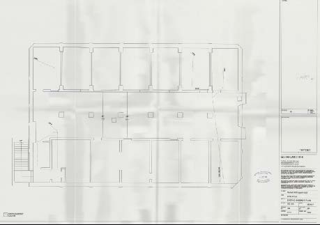 This image displays a faint black and white architectural floor plan showing the internal layout of rooms, walls, and a staircase.