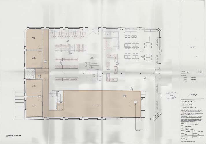 This image shows a detailed architectural ground floor plan of a commercial property, illustrating the internal layout for a cafe, shop, and office spaces with furniture arrangements.