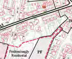 A close-up view of a site plan or location map showing property boundaries marked in red and text indicating 'Predominantly Residential' land use.