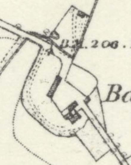 A close-up view of a site location plan or map showing building footprints, roads, and a benchmark elevation.