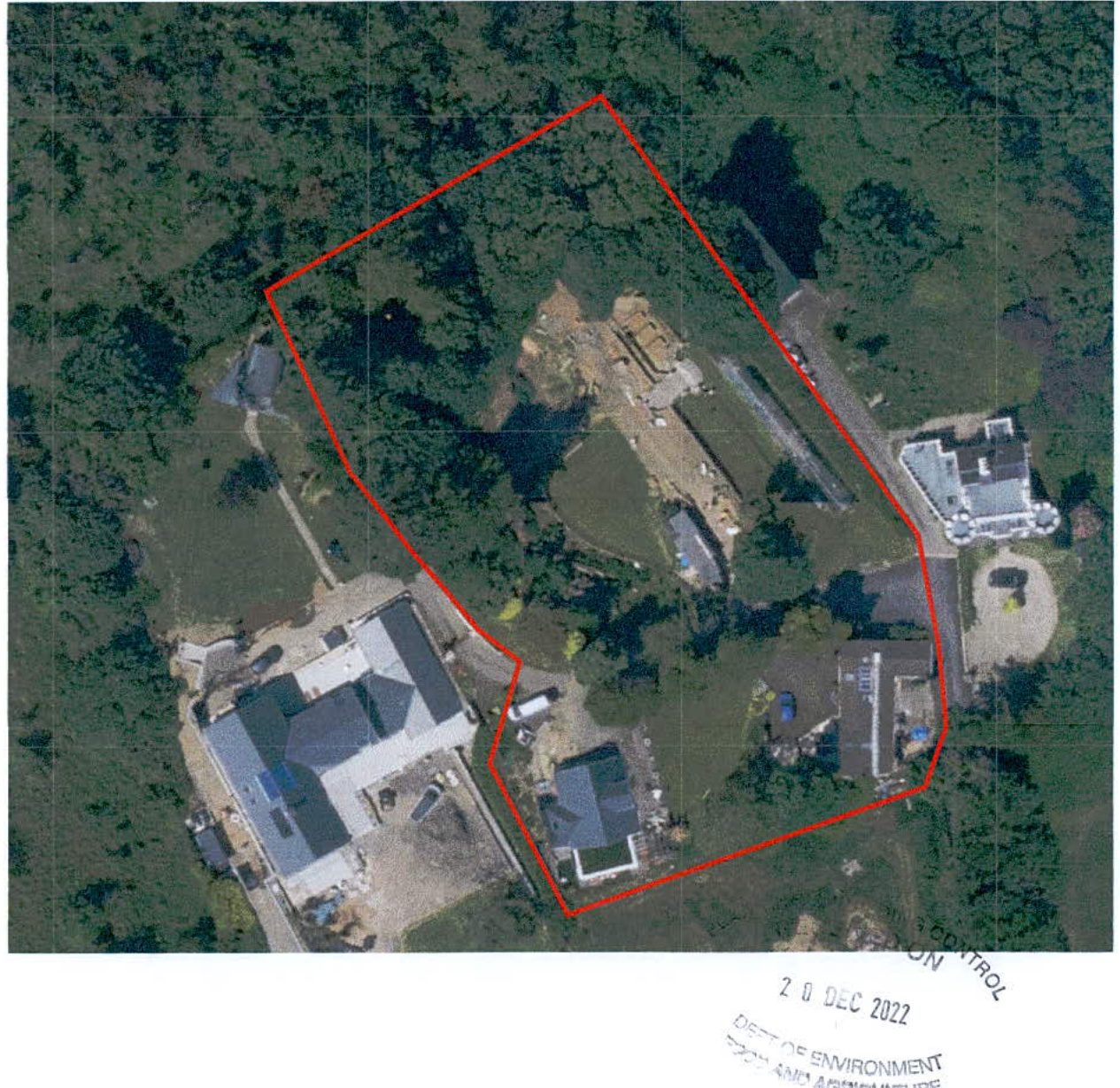 An aerial site plan showing a rural property with a red boundary line outlining the application area and existing structures.