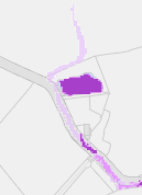 This image displays a site plan or map featuring a large purple polygon representing a building footprint and a smaller linear purple shape, likely indicating a boundary or drainage feature.