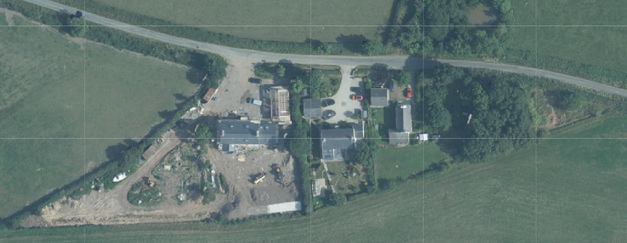 Aerial site location map showing a rural property with buildings under construction surrounded by fields.