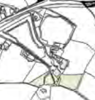 A hand-drawn style site plan showing building outlines, property boundaries, and a highlighted plot area.