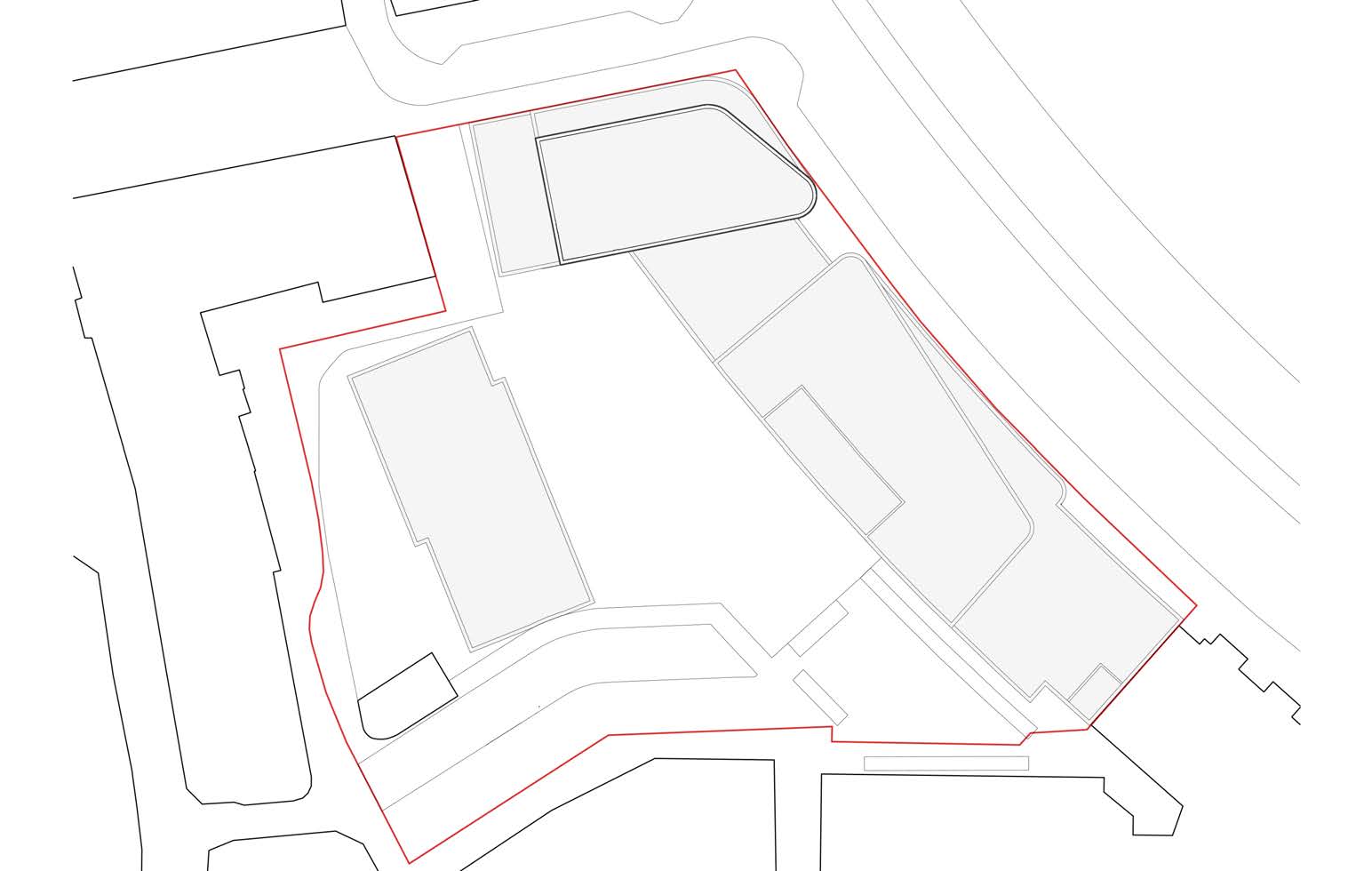 This image displays a site plan illustrating the proposed building footprints and site boundaries for a commercial development.