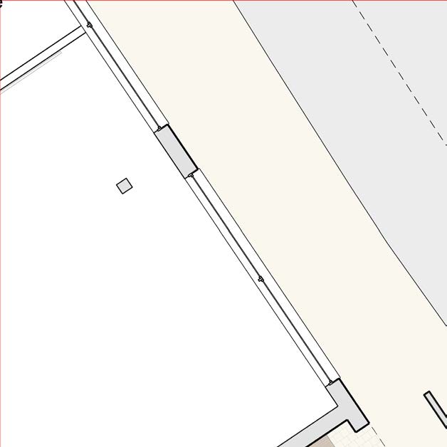 A detailed section of a site plan showing property boundaries, a road or path edge, and a grey shaded area indicating a structure or feature.