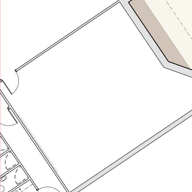 A partial architectural floor plan showing a large open room, door swings, and a section of a utility area with fixtures.