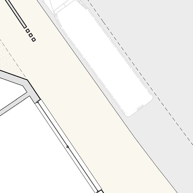 A technical site plan detail showing a road, property boundaries, and a large rectangular development footprint.