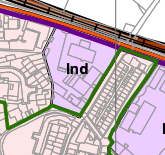 A planning map or site plan showing land use zoning, with a purple area labeled 'Ind' and distinct green boundary lines.