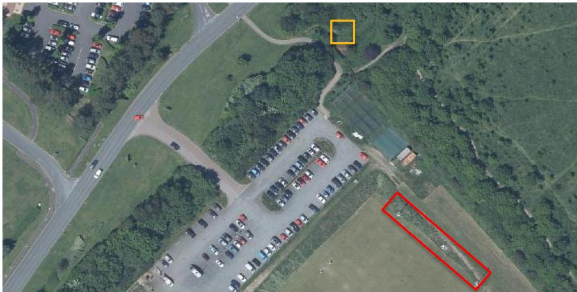 An aerial site location map showing a parking lot and adjacent fields, with red and yellow boxes highlighting specific areas of interest for the proposed development.