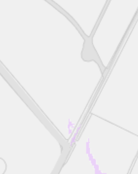 A cropped section of a map showing road lines and faint purple boundary markings.