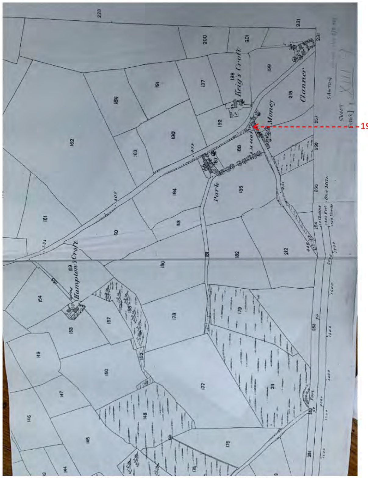 A scanned historical land survey map displaying rural field boundaries, plot numbers, and handwritten road names.