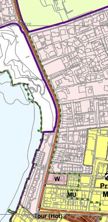 A site location map showing a coastal area with a purple boundary line outlining the development site and surrounding land use zones.