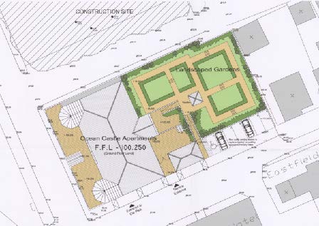 Architectural site plan showing the layout of Ocean Castle Apartments, including landscaping, parking, and building footprint.