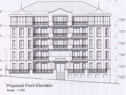 This is a black and white architectural elevation drawing showing the proposed front facade of a multi-story residential building labeled 'Ocean Castle'. The drawing includes detailed annotations for floor levels and...