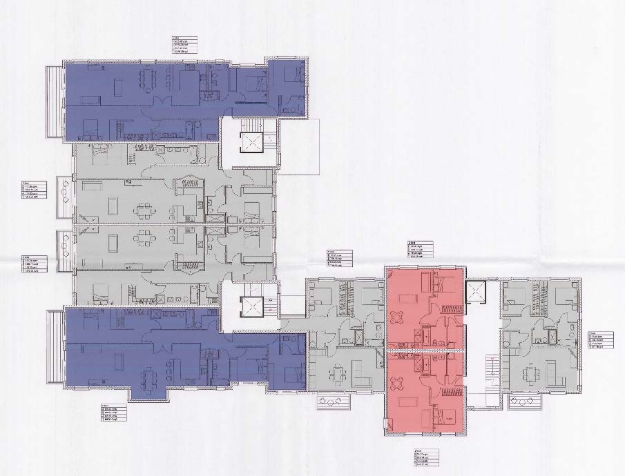 Architectural floor plan showing the layout of multiple apartment units with furniture and room divisions.