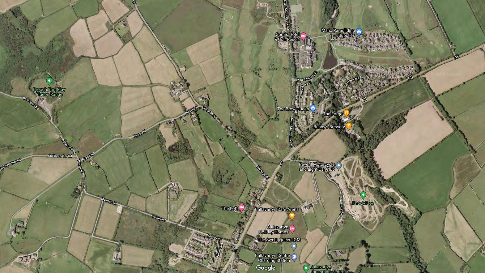 Aerial satellite map view showing the rural site location in Santon, Isle of Man, surrounded by fields and roads.