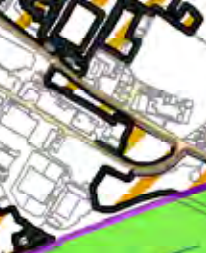 A zoomed-in section of a site plan showing building footprints, road layouts, and colored boundary demarcations.