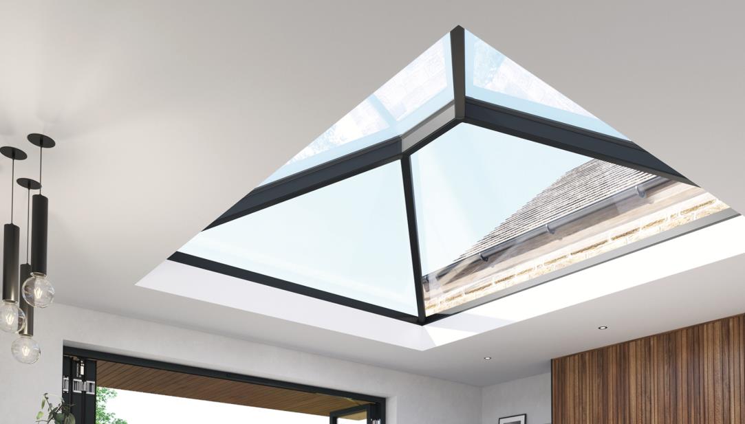 Interior perspective view of a modern sun room featuring a large pyramid rooflight and contemporary pendant lighting.