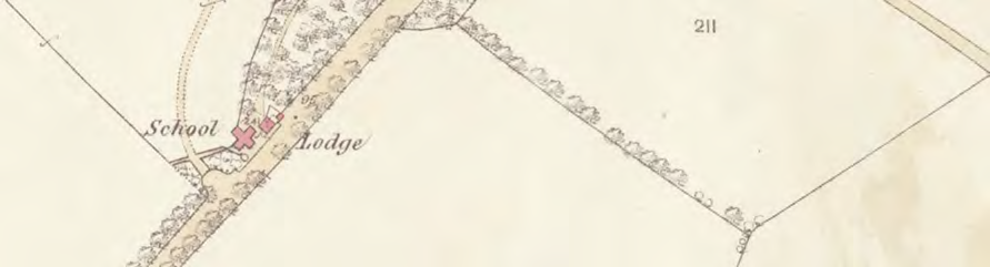 A vintage map extract showing a road junction with labels for 'School' and 'Lodge' and red crosses indicating specific sites.