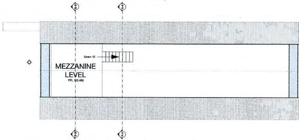 Architectural floor plan showing a mezzanine level layout with stairs and grid references.