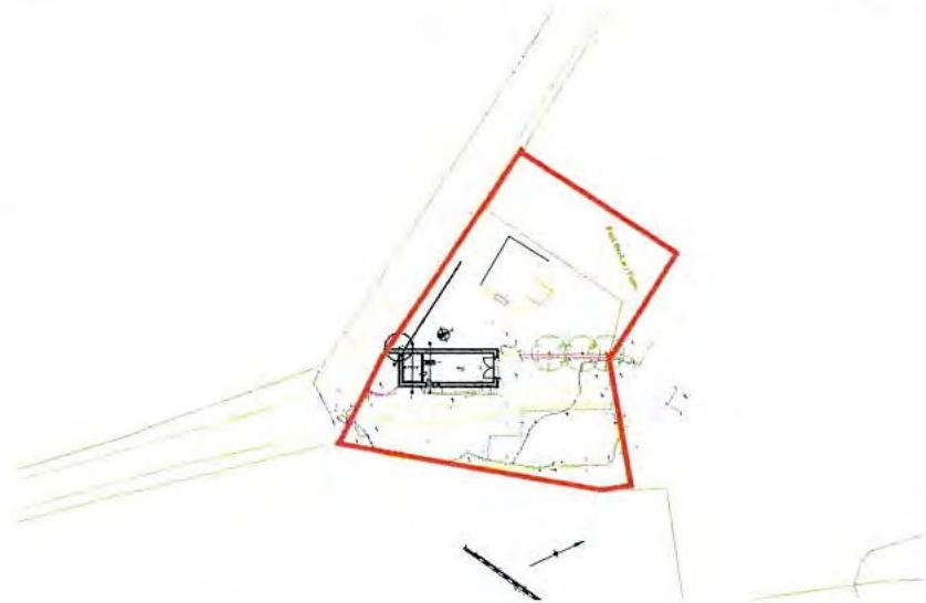 A site plan showing the property boundary outlined in red, with a proposed building footprint and landscaping features.