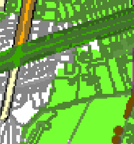 A low-resolution, pixelated map extract showing green land parcels, grey structures, and linear boundaries.