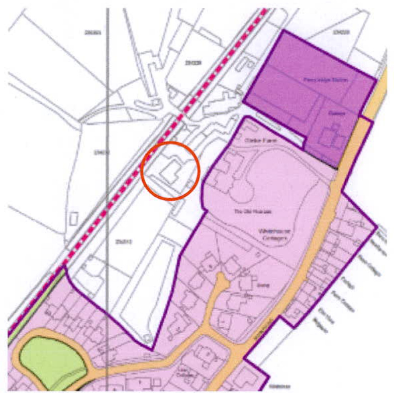 A site plan showing property boundaries, building footprints, and colored zones, with a specific building highlighted by an orange circle.