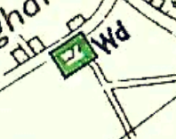 A close-up section of a site location map showing road lines, field boundaries, and a green highlighted square marker.