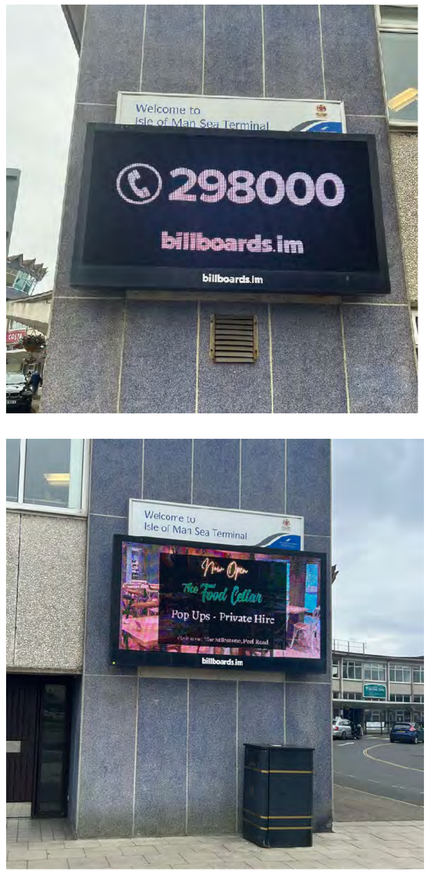 Two photographs showing a large digital advertising screen mounted on the exterior wall of the Isle of Man Sea Terminal building.