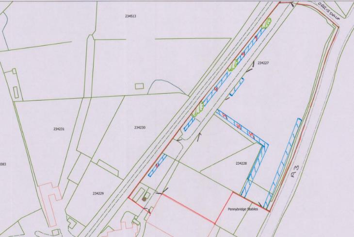 A site plan showing the proposed layout of campervan pitches along a road with field boundaries and plot numbers.