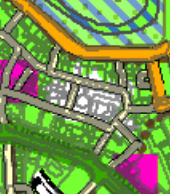A low-resolution, colorful site plan showing building footprints, roads, and land boundaries.