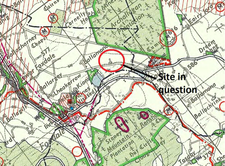 A topographical map showing the location of the proposed development site, marked with a red circle and arrow labeled 'Site in question' amidst rural features like plantations.