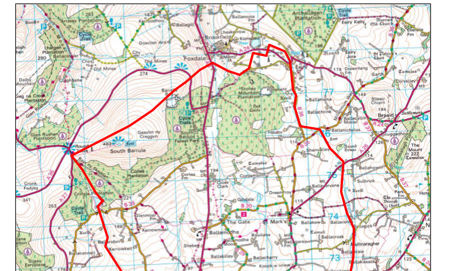 A topographic location map showing a specific site outlined in a thick red boundary line, surrounded by roads, forests, and nearby settlements like Foxdale and South Barrule.