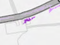 A zoomed-in section of a site plan or location map showing a road, property boundaries, and purple highlighted areas.
